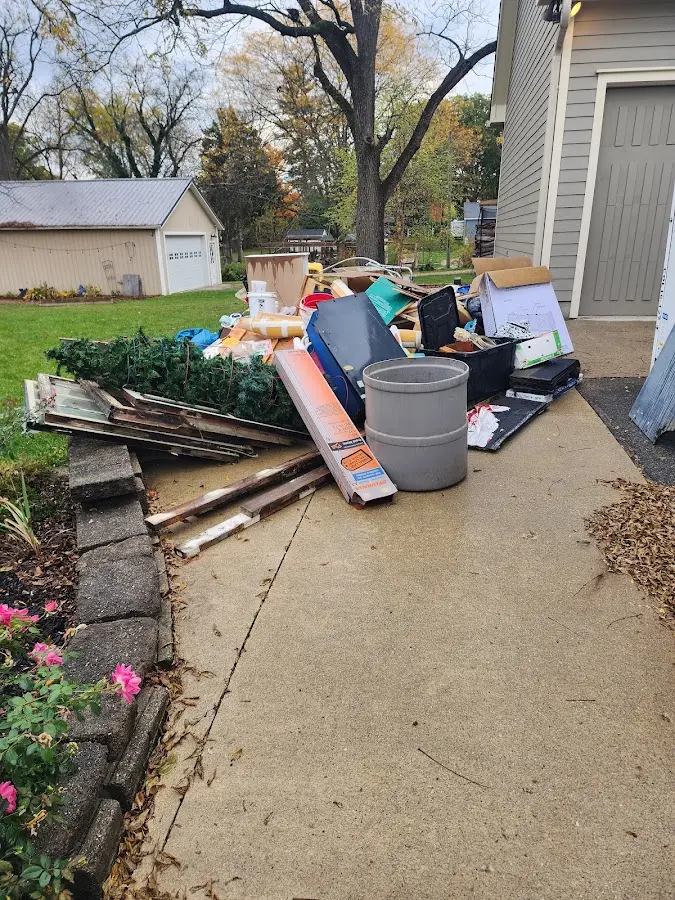 Dumpster being loaded with debris for 3 Yard Dumpster Rental in Clarkstown